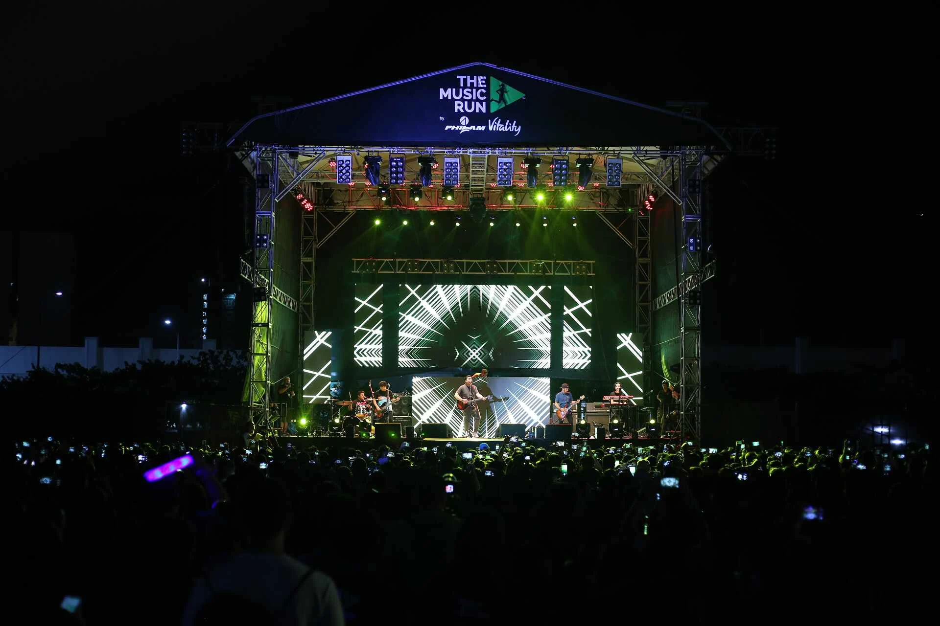 Wide view of the Music Run Manila night stage and festival crowd