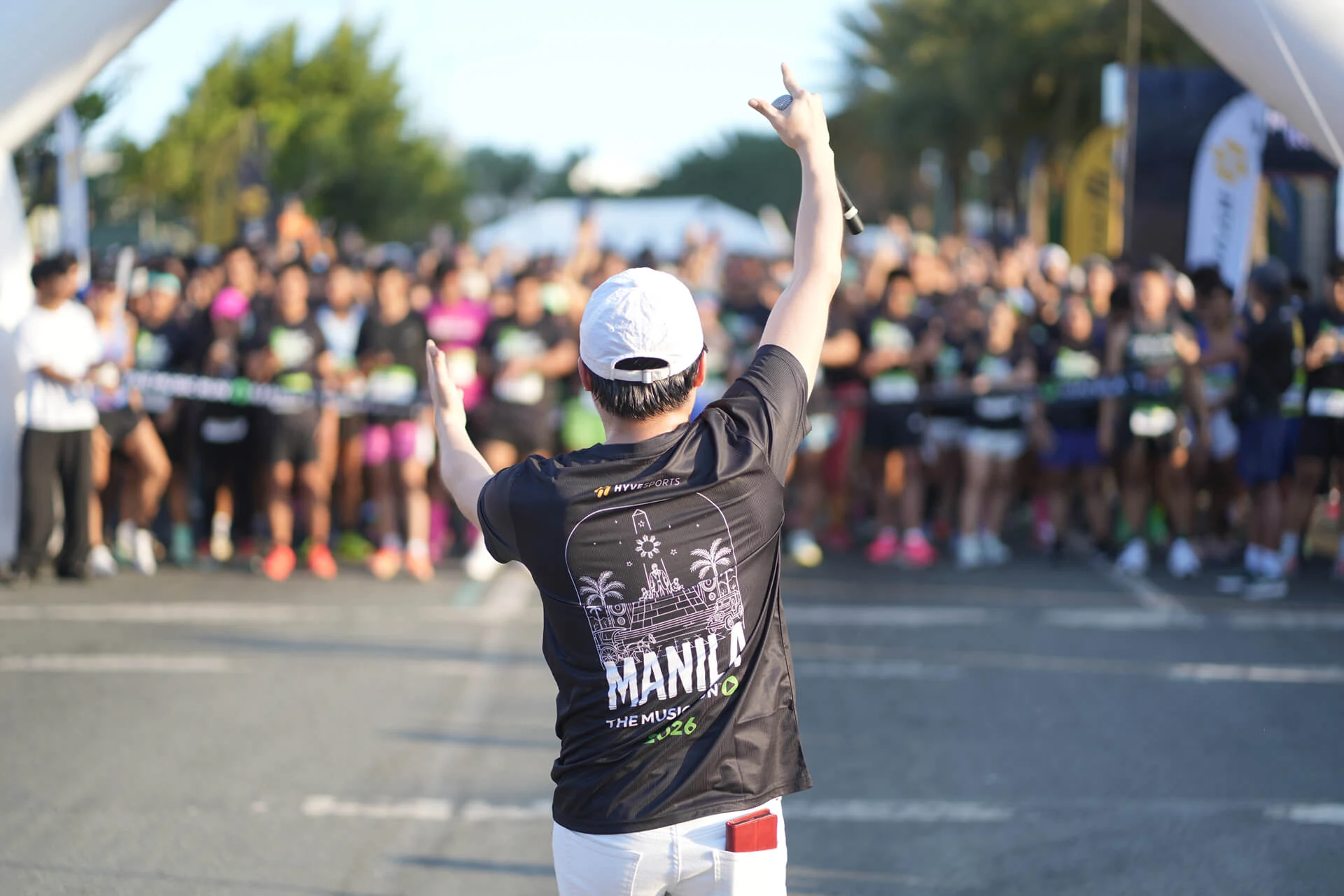Music Run Manila starter energizing participants before the run